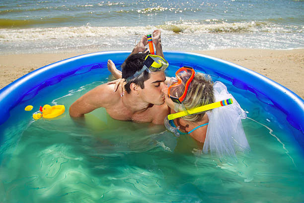 istock Newly-married couple enjoying on the beach 482256125