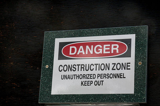 istock Danger Construction Zone sign on dark plywood 482257668