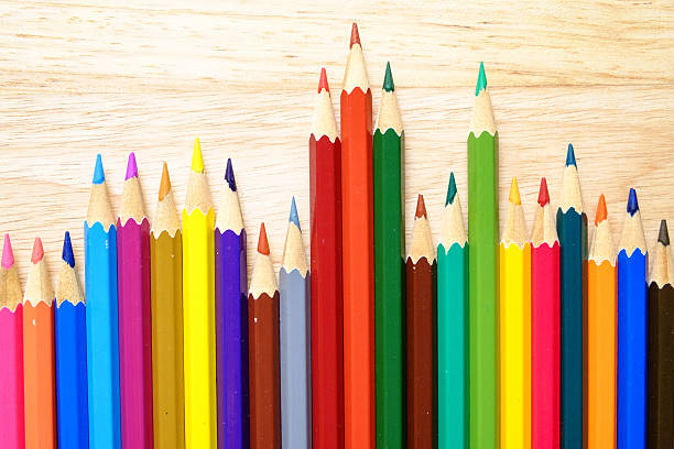 istock Color pencils on wood background 482260296