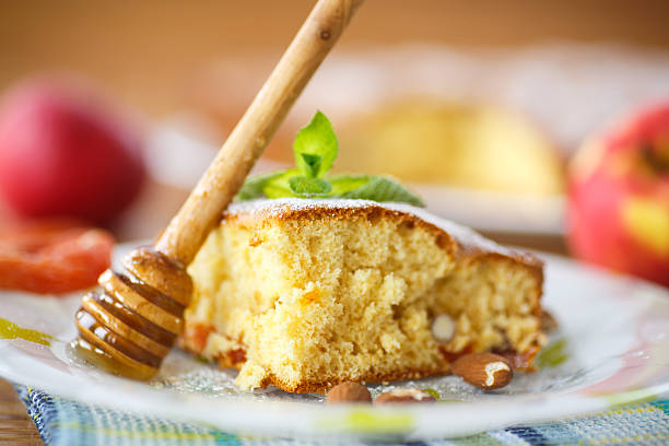 sponge cake with dried apricots and almonds stock photo