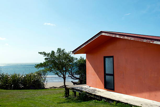 There is nothing so Kiwiana as a self-built Kiwi bach by the Sea.