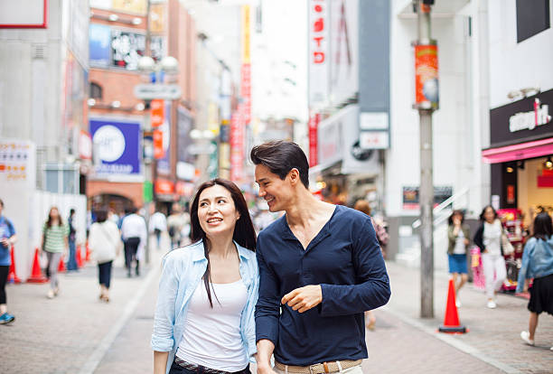 istock Young couple against cityscape background 482263102