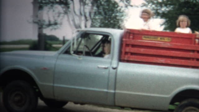 (8mm Vintage) 1966 Girls Riding Back Of Farm Truck in Iowa, USA.