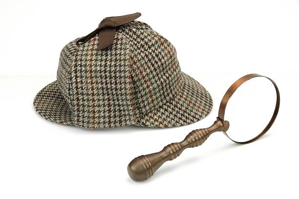 istock Deerstalker Cap And Vintage Magnifying Glass Iso 482266612