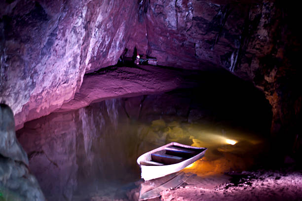 Boat in the cave stock photo