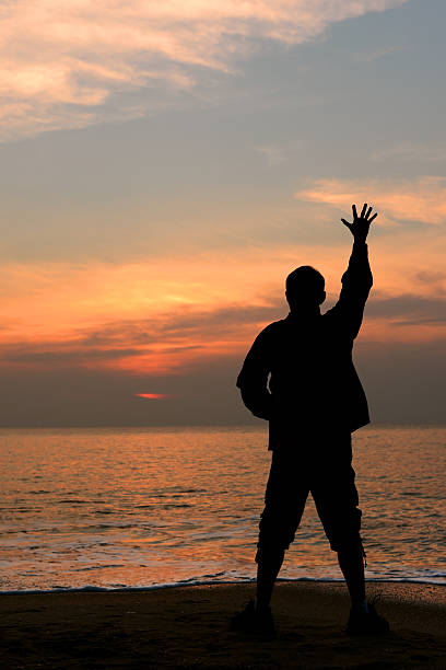 istock Silhouette happy man at the beach 482270642