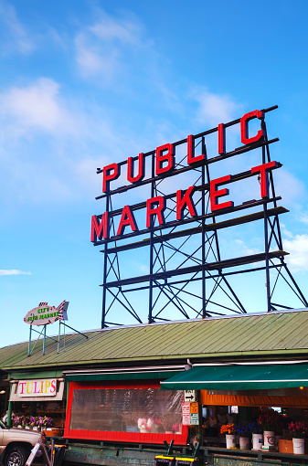 Seattle, USA - May 9, 2014: Famous Pike Place market sign in Seattle, WA. The Market opened in 1907, and is one of the oldest continuously operated public farmers' markets in the US.