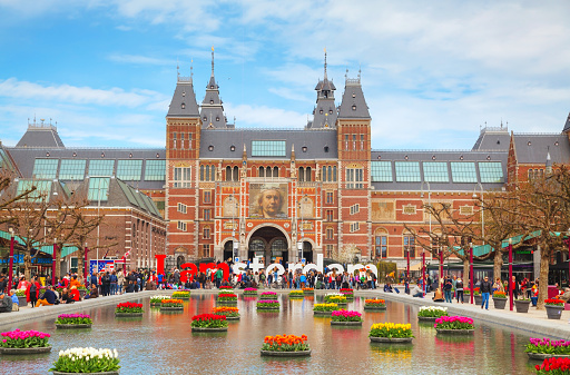 Canal tour boat outside Amsterdam Centraal Railway Station, Amsterdam, Netherlands