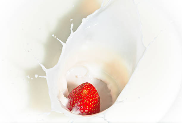 istock The strawberry falling in milk 482275916