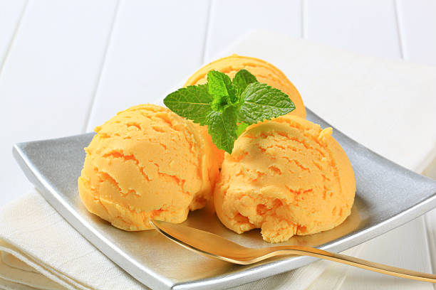 istock Scoop of orange ice cream 482277040