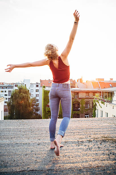 istock carefree summer day: rear view of young woman, feeling free 482277236