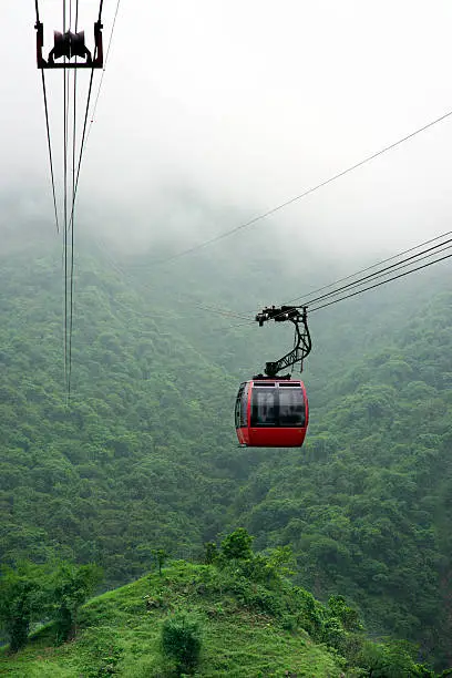 a cable car moving along in the hills