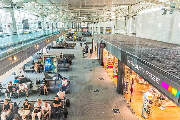 people in the terminal of Marseille Provence Airport Marseille, France - July 6, 2015: people in the terminal of Marseille Airport in Marseille, France. It is the fifth busiest French airport by passenger traffic and third largest for cargo traffic marseille station stock pictures, royalty-free photos & images