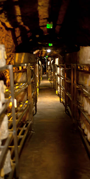 Corridor in the cave between cheeses stock photo