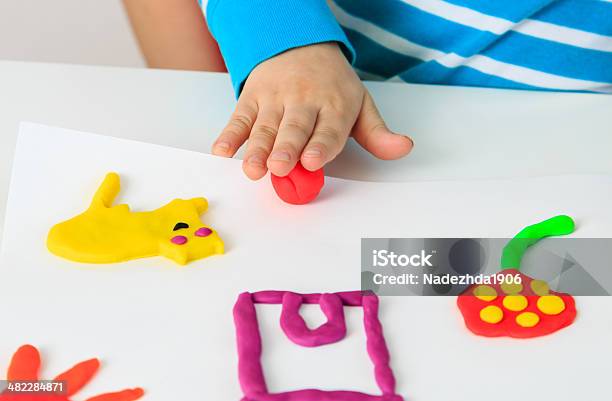 Child Playing With Clay Molding Shapes Stock Photo - Download Image Now - Child's Play Clay, Child, Toddler