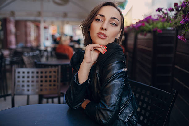 istock pretty girl sitting in a cafe 482284876