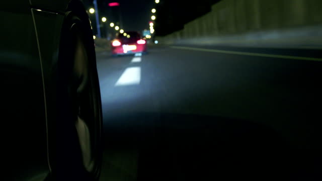 Sports car highway wheel at night