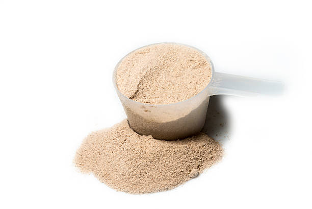 istock Scoop of chocolate flavour protein powder isolated 482288480
