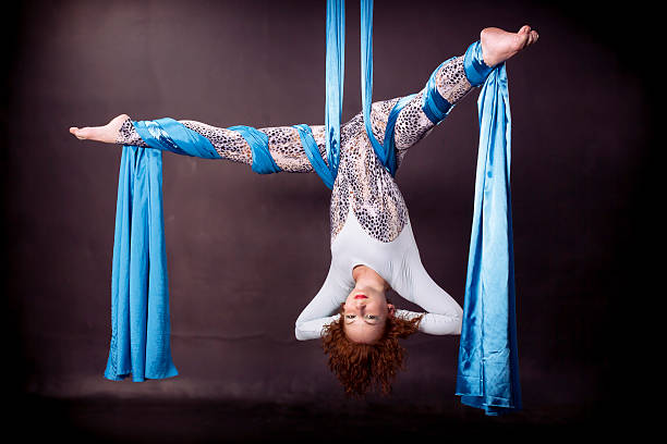 istock Young gymnast doing exercise on aerial silks 482296046