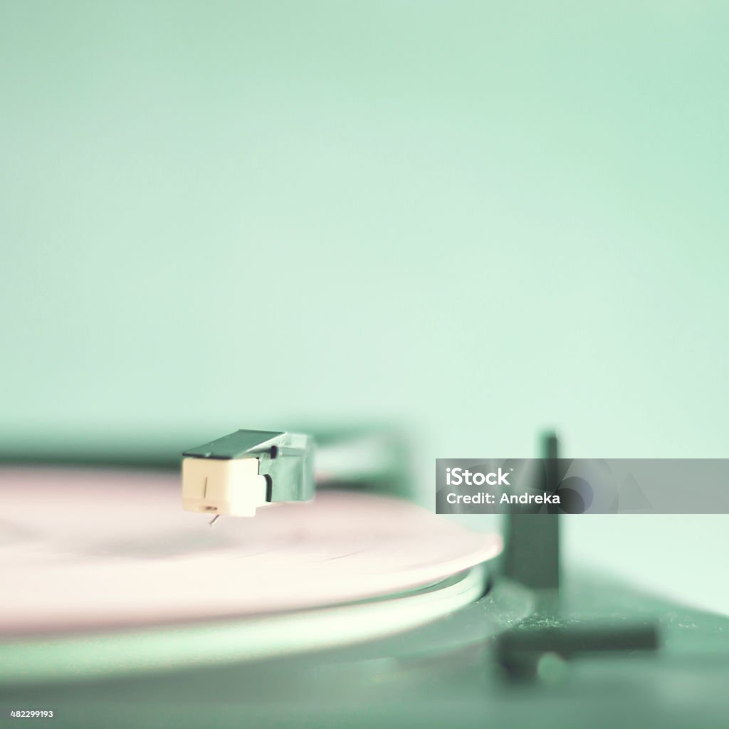 Vintage turntable with pink record Vintage turntable with pink vinyl record Antique Stock Photo