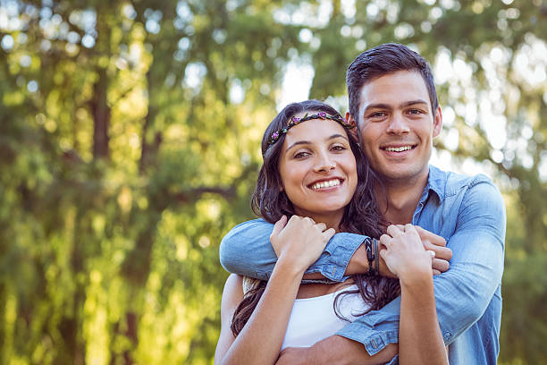 istock Cute couple smiling in the park 482302216