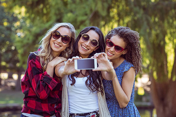 istock Happy hipsters taking a selfie in the park 482302466
