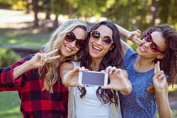 istock Happy hipsters taking a selfie in the park 482302470