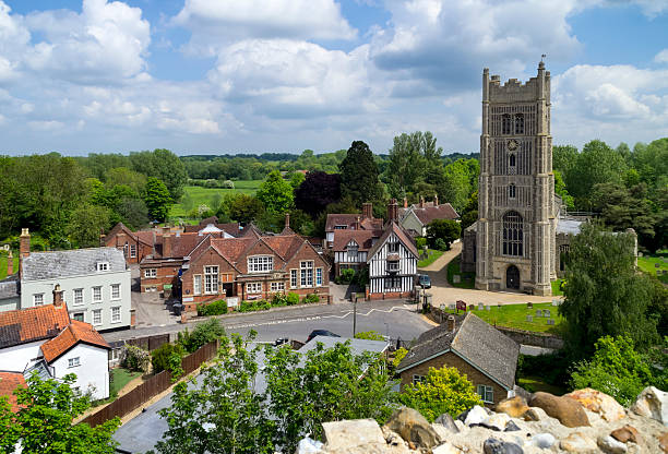 Eye, Suffolk, England - May 26, 2015: A view from the top of Eye Castle, Suffolk, down to Church Street and the parish church of St Peter & St Paul, the school and across fields. Eye is a small and pretty town in eastern England, frequently visited by tourists.