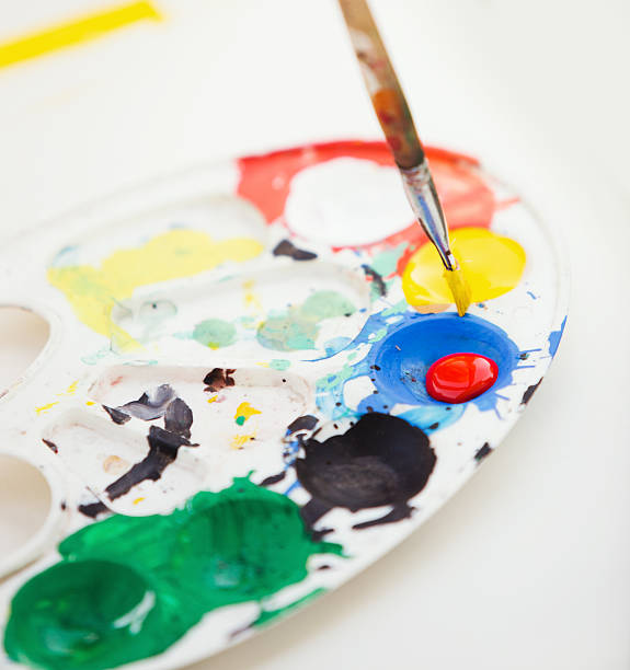 istock Plastic paint palette with paint and brush, close up photo 482303038