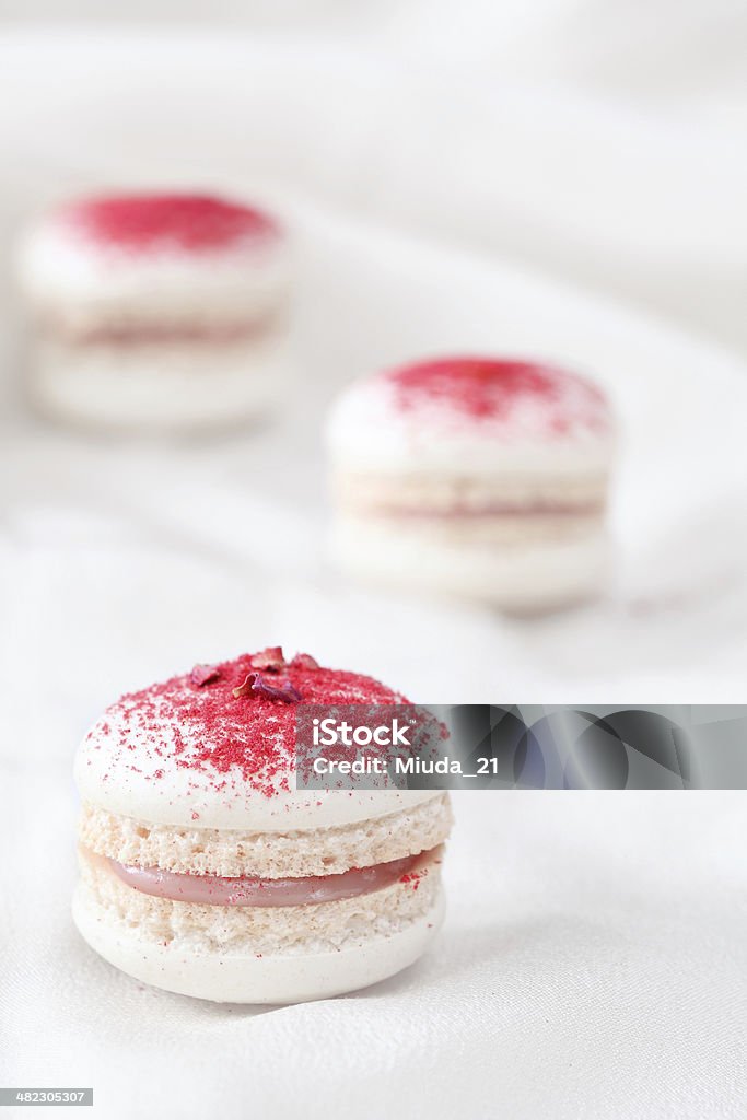 Raspberry and Rose Water Macarons Raspberry and Rose Water Macarons on a light background. Almond Stock Photo