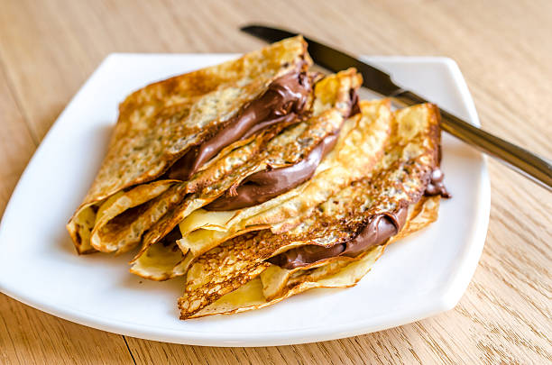 Crepes with chocolate cream Crepes with chocolate cream crêpe pancake photos stock pictures, royalty-free photos & images