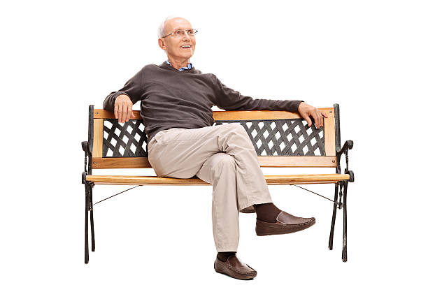 istock Cheerful senior sitting on a wooden bench 482307244
