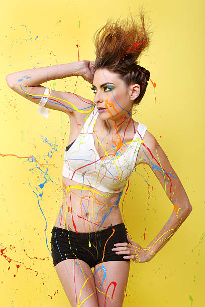 istock Sexy Woman Splashed With Colorful Paint 482308343