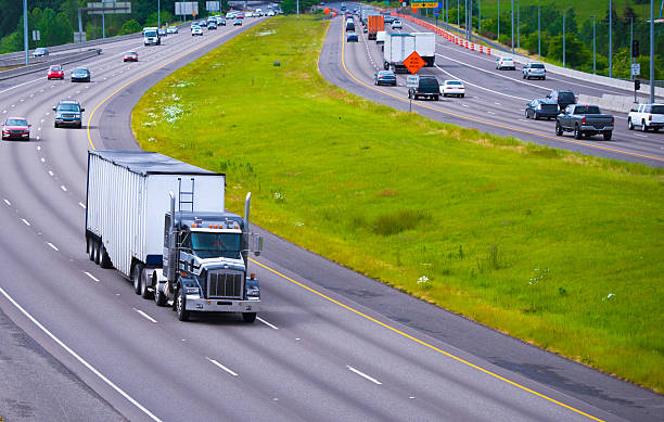 Divided Highway Curve large semi truck with bulk trailer
