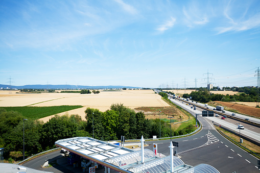 Eschborn, Germany - July 10, 2015: Highway A5 towards north and Sauerland seen from resting area Taunusblick close to Frankfurt Main. In bottom area is Shell gas station.