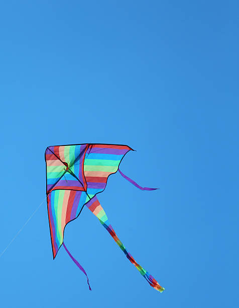 istock big kite flies free colored in sky blue 482310762