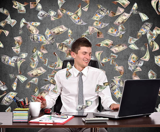 istock businessman  and falling dollar bills 482311046