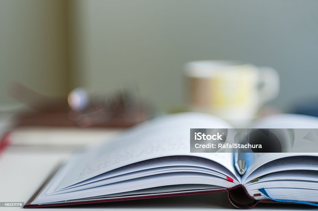 Open Notebook Blurred Background Close up of open notebook blurred with very shallow depth of field 2015 Stock Photo