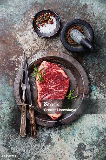 Raw Fresh Meat Striploin Steak And Spices Stock Photo - Download Image Now - Carving Knife, Fork, Marbled Effect