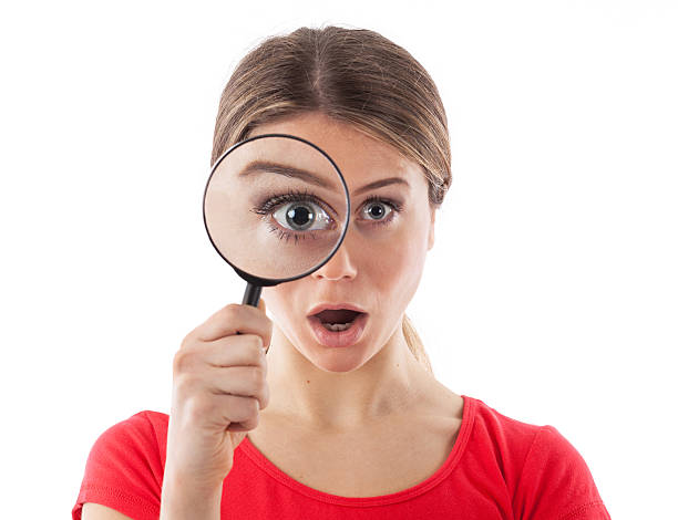 istock Girl with a magnifying glass 482319795