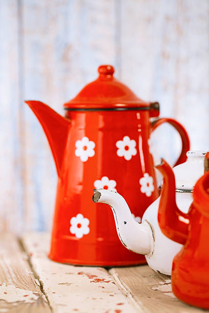 istock Red and white Enamel Tea Coffee Pots on wood 482321688