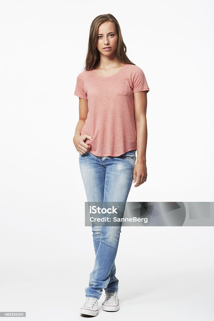 Portrait of young woman in studio Standing Stock Photo