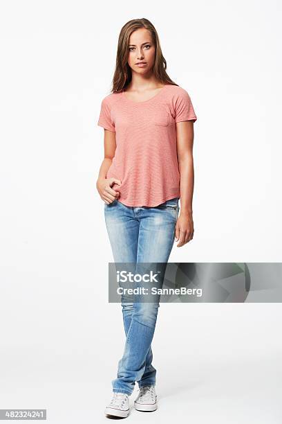 Portrait Of Young Woman In Studio Stock Photo - Download Image Now - Standing, One Woman Only, Full Length