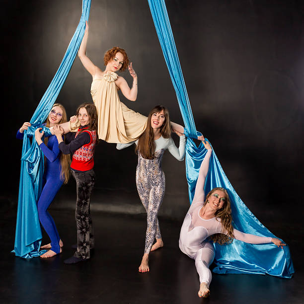 istock Five aerial gymnasts with silk 482325376