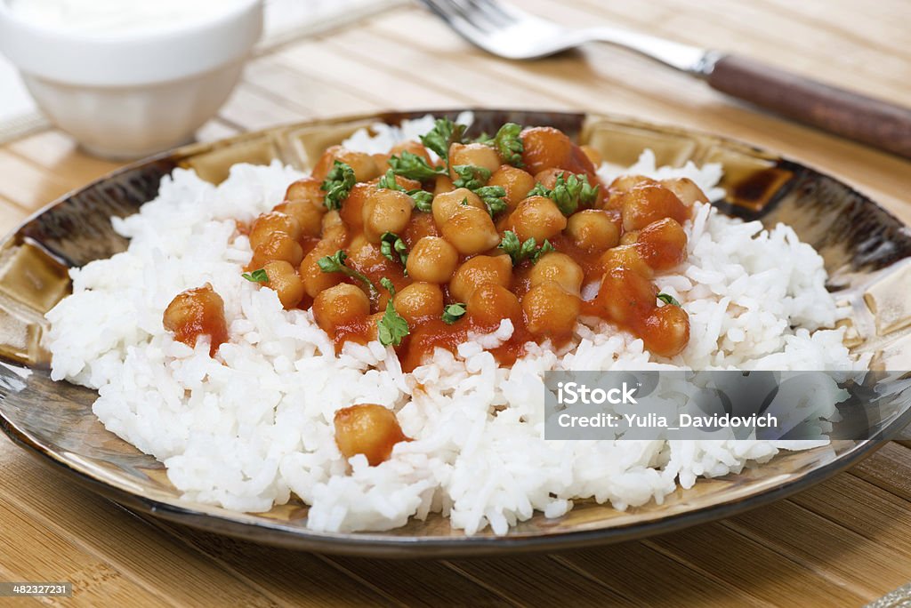 rice with chickpeas in tomato sauce rice with chickpeas in tomato sauce, close-up Appetizer Stock Photo