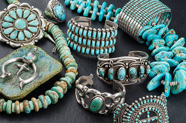 Collection of Native American Turquoise and Silver Jewelry. Vintage Native American Turquoise and Sterling Silver Jewelry, Necklaces, Bracelets and Concho on a black background. turquois stock pictures, royalty-free photos & images