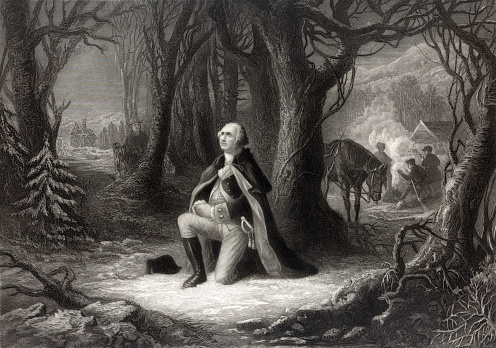 This vintage image depicts George Washington praying.