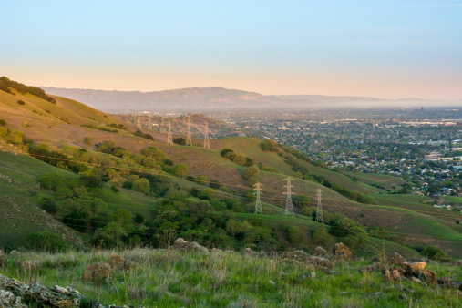 Early morning sun starts to illuminate the foothills of sprawling San Jose.