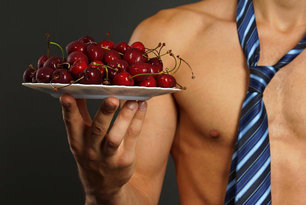 Red fresh cherry on plate