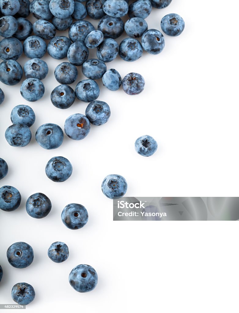 Fresh blueberries sprinkled Fresh blueberries sprinkled. Isolated on white background Blueberry Stock Photo